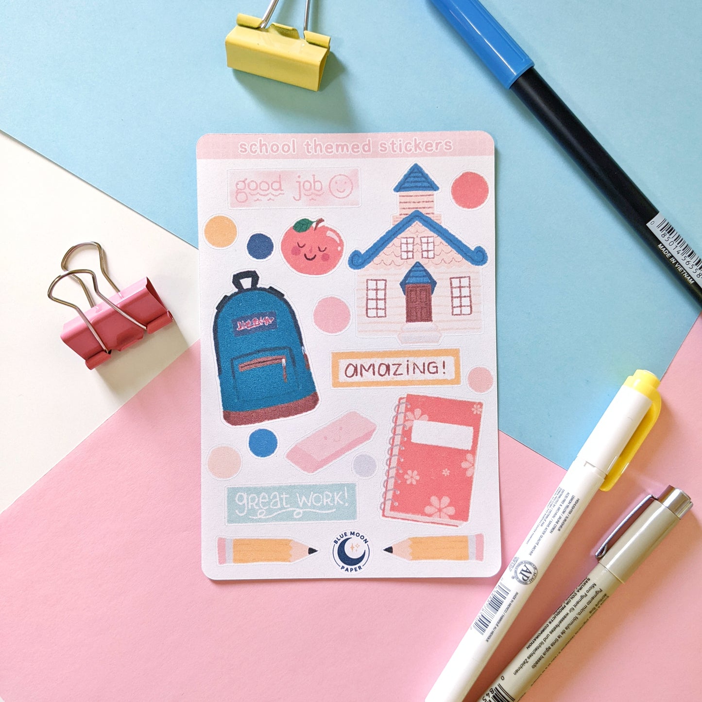 Sticker sheet featuring various school-themed items such as a schoolhouse, backpack, eraser, and pencils.