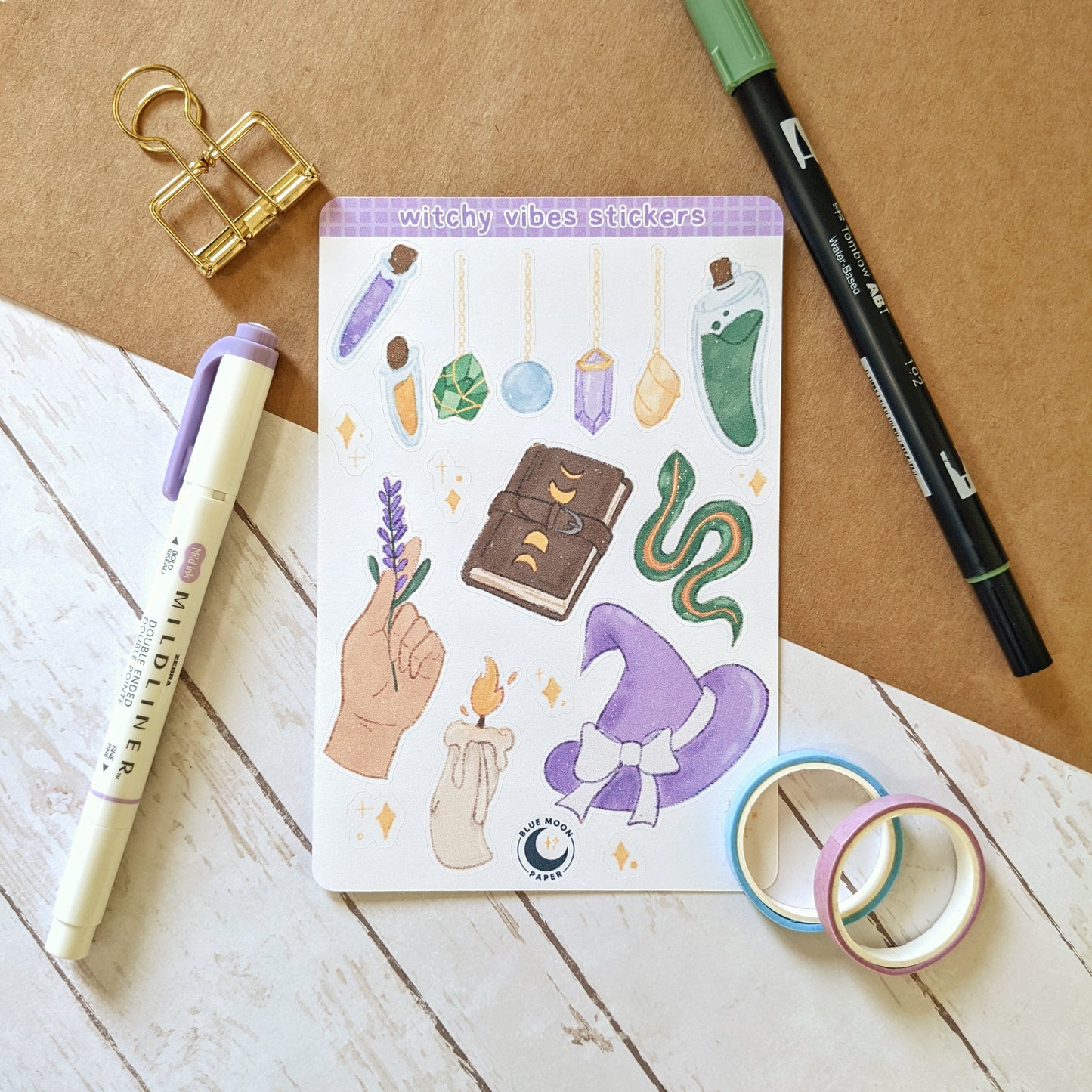 Sticker sheet with witch themed illustrations such as crystals, a snake, potions, and a witch hat.