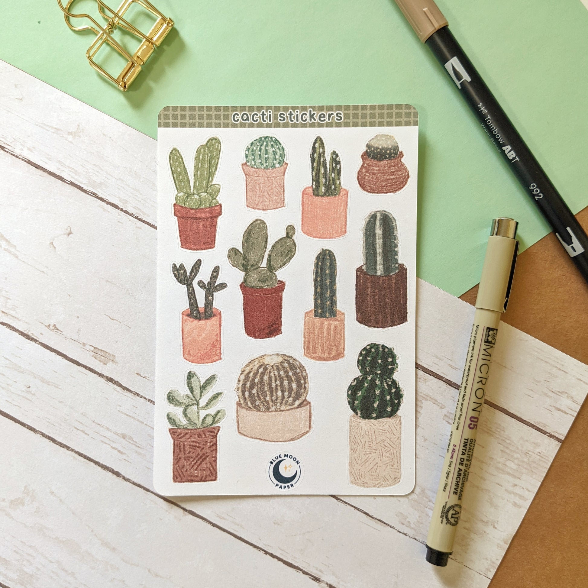 A sticker sheet of illustrated cacti of different variations.