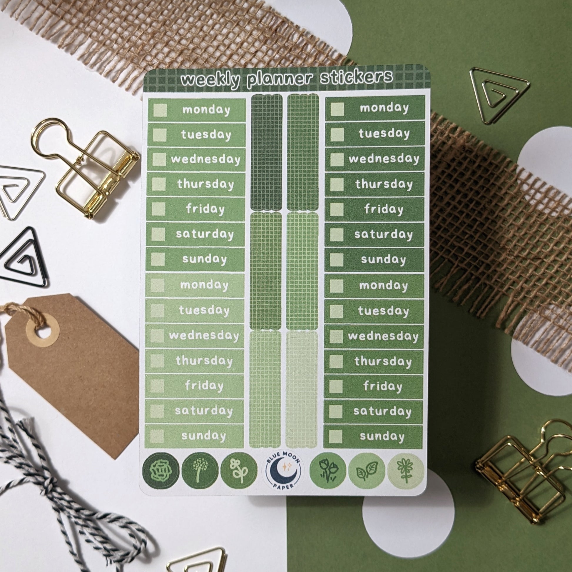 Green sticker sheet with the days of the week on it, rectangles, and dots with floral illustrations.